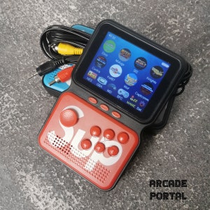 May include: A black and red handheld video game console with a screen displaying a menu of classic video games. The console has a red button with the word "Sup" printed on it. The console is connected to a television with an AV cable.