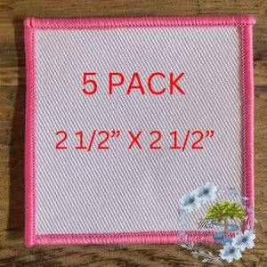 May include: A pack of five white iron-on patches with a pink border. The patches are 2 1/2 inches by 2 1/2 inches.