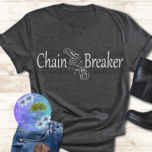 May include: A dark gray t-shirt with a white graphic of a broken chain and the text "Chain Breaker".