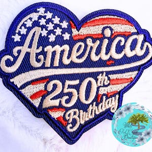 May include: Embroidered patch in a heart shape, featuring the text "America 250th Birthday." The design incorporates the American flag's colors: red, white, and blue, with stars and stripes. The patch has a blue border.