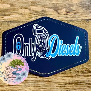 May include: Black leather patch with white outline of a turbocharger and the text "Only Diesels" in blue.