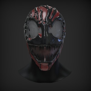 Puede incluir: Una máscara de plástico negra y roja con una sonrisa amenazante y una malla que cubre los ojos. La máscara está diseñada para parecerse a una criatura con dientes afilados y una sustancia viscosa que gotea.