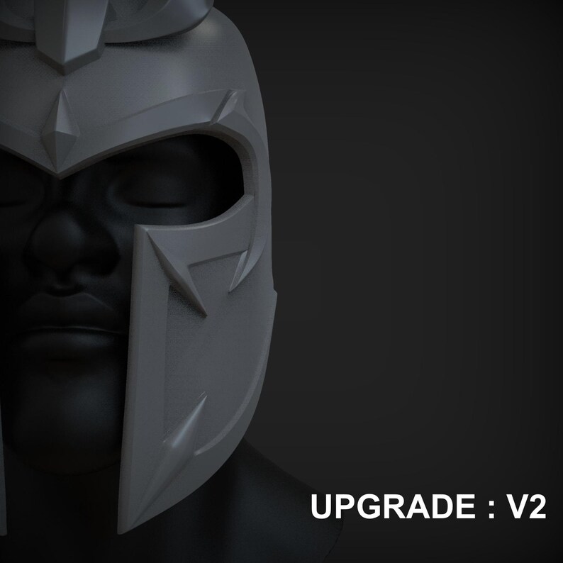 Peut inclure: Un casque gris imprim&eacute; en 3D avec une cr&ecirc;te pointue et un masque facial. Le casque a un design angulaire et pointu avec des d&eacute;tails complexes. Le texte "UPGRADE: V2" est visible en bas de l'image.