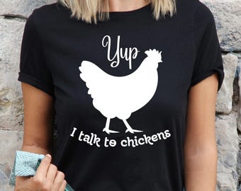 May include: Black t-shirt with a white silhouette of a chicken and the text "Yup, I talk to chickens".