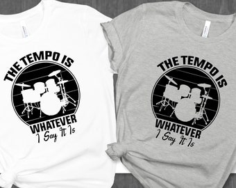 May include: Two t-shirts, one white and one grey, with a black and white graphic of a drum set and the text "The Tempo Is Whatever I Say It Is".