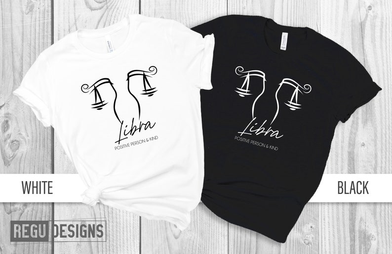 May include: Two t-shirts, one white and one black, with a Libra zodiac symbol and the text "Libra Positive Person & Kind".