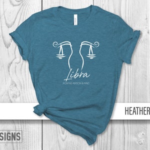 May include: Teal heather t-shirt with a white Libra zodiac symbol and the text "Positive Person & Kind".