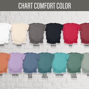 May include: Chart of t-shirt colors with names for each color: White, Ivory, Pepper, Black, Red, Crimson, Yam, Orchid, Blue Jean, Blue Spruce, Seafoam, Light Green, Bay.