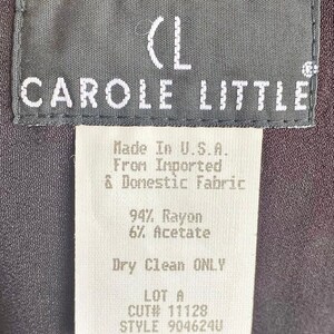 May include: A white tag with black text that reads "(L CAROLE LITTLE Made In U.S.A. From Imported & Domestic Fabric 94% Rayon 6% Acetate Dry Clean ONLY LOT A CUT# 11128 STYLE 904624U SIZE 6"