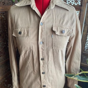 Vintage 80s tan, medium weight denim button up by Levi’s