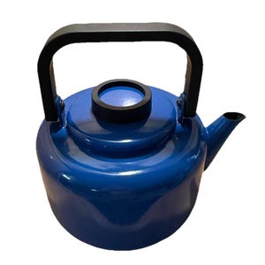 May include: A blue enamel kettle with a black handle and spout. The kettle has a rounded body and a black rim around the lid. The handle is arched and attached to the sides of the kettle. A classic kitchenware item.