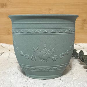 May include: A rustic wooden sign with the text "Welcome to our home" in a handwritten style. The sign features a distressed finish and a simple, inviting design, perfect for a front porch or entryway.