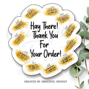 May include: A white, scalloped-edge sticker with the text "Hay There! Thank You For Your Order!" in black. The sticker features yellow and brown brushstroke designs with white string accents. The words "CREATED BY GRACEFUL DEVOUT" are at the bottom.