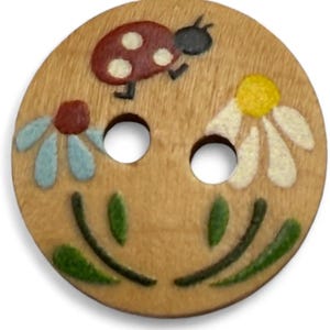 May include: A round wooden button with a painted design. The button features a red ladybird with white spots, two daisies, and green leaves. The button has two holes for sewing.