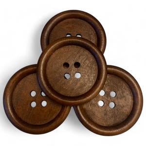May include: Four brown wooden buttons with four holes each. The buttons are arranged in a triangular shape.