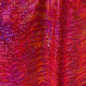 May include: Red iridescent fabric with a textured, scaly pattern. The fabric has a shiny, holographic finish.