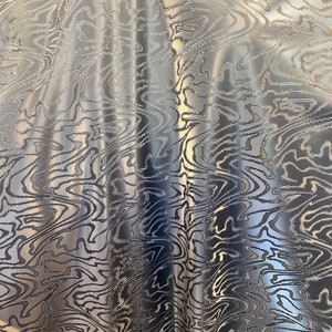 3D black latex double dimension shiny 4 way stretch with thick spandex fabric sold by the