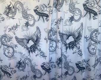 May include: White fabric with a repeating pattern of black dragons, hearts, roses, and the words "Love" and "Forever".