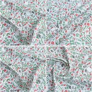 May include: White fabric with a repeating pattern of green and red mahjong tiles. The tiles feature Chinese characters and symbols.