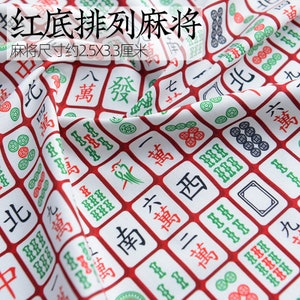 May include: Red background fabric with a white and green mahjong tile pattern. The tiles have Chinese characters and symbols. The fabric is approximately 2.5 inches by 3.3 inches.