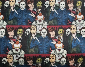 May include: A black and white fabric with a repeating pattern of horror movie characters. The characters include Jason Voorhees, Freddy Krueger, Michael Myers, and Pennywise the Dancing Clown. The fabric is perfect for crafting projects, such as costumes, bags, and home decor.