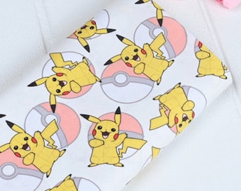 May include: White fabric with a repeating pattern of yellow Pikachu characters and pink and white Poké Balls. The fabric is folded, displaying the design. Suitable for crafting or sewing projects.
