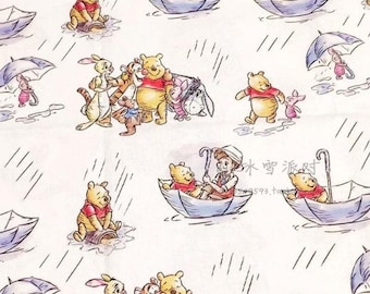 May include: A white fabric with a repeating pattern of Winnie the Pooh and his friends. The characters are depicted in various scenes, including riding in an umbrella boat, playing in the rain, and standing together. The background is a light cream color with a subtle rain pattern.