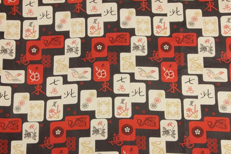 May include: Fabric with a repeating pattern of red, white, and gold Mahjong tiles and symbols on a dark gray background. The design includes Chinese characters, flowers, and bird illustrations.