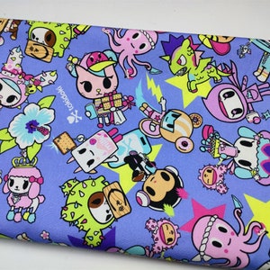 May include: Purple fabric with a repeating pattern of colourful cartoon characters, including a cat, a monkey, a cactus, and an octopus. The fabric also features stars and the text "Tokidoki".