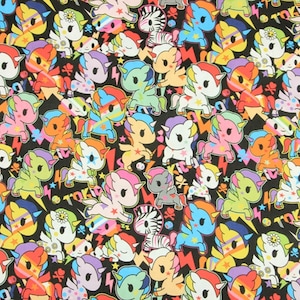 May include: A black fabric with a repeating pattern of colourful cartoon unicorns. The unicorns are in various poses and have rainbow manes and tails. The background is black with white stars and lightning bolts.