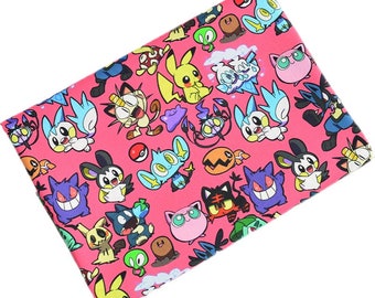 May include: Pink fabric with a repeating pattern of cartoon Pokemon characters. The characters include Pikachu, Charmander, Squirtle, Bulbasaur, and many more.