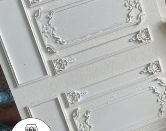 May include: White, decorative wall panel with ornate, raised, floral designs. The panel is made of a lightweight material and is ready to be painted.