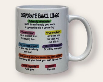 May include: White ceramic coffee mug with a colorful graphic of corporate email lingo. The text includes phrases like "Friendly reminder", "To reiterate", "Per my last email", "I've copled", "Moving forward", "Not sure if you've seen my last email", "Kind regards", and "000".