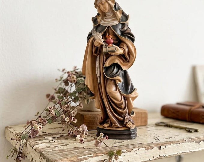 Sculpture of Saint Gertrude the Great carved in Valgardena wood, hand-decorated and handcrafted in Italy.