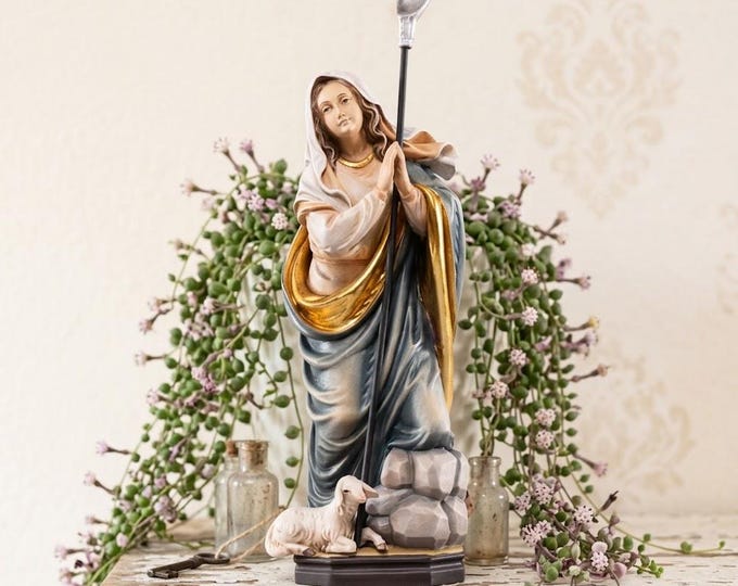 Sculpture of Saint Genevieve carved in Valgardena wood, hand-decorated and handcrafted in Italy.