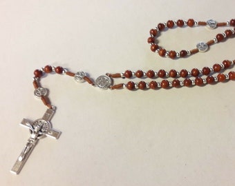 Rosary of Saint Benedict of Norcia in rosewood tied with a cord and a metal cross, handcrafted in Italy.