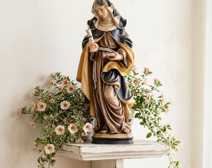 Sculpture of Saint Eva of Liège carved in Valgardena wood, hand-decorated and handcrafted in Italy.