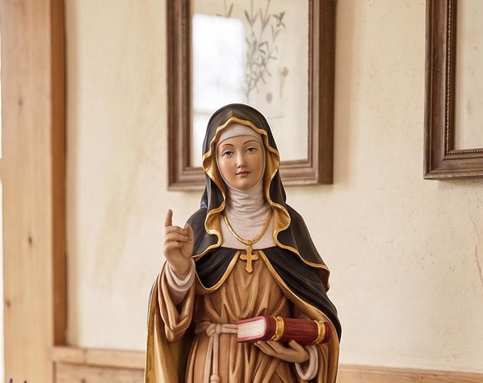 Statue of Saint Adelgunda with a book carved from Valgardena wood and hand-decorated, Italian artisan production.