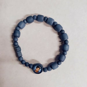 Blessed Carlo Acutis&#39;s blue stretch wood rosary bracelet, handcrafted in Italy.