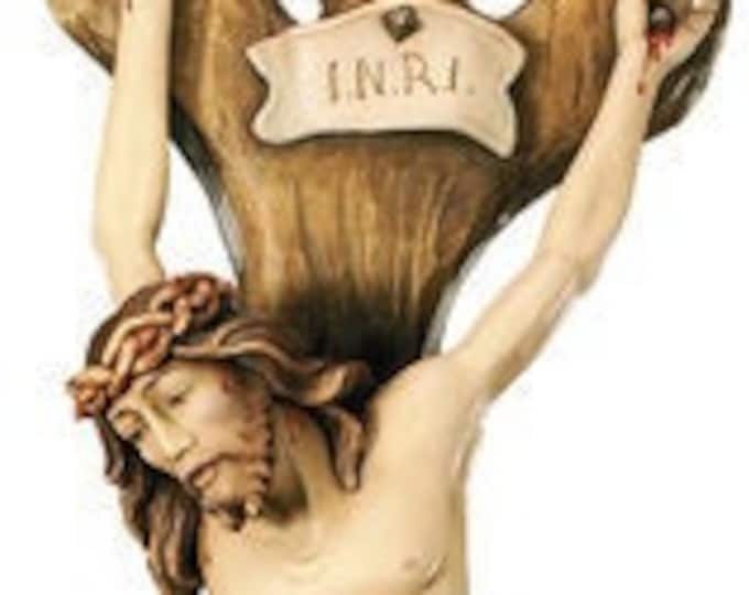 Christ crucifix in relief, carved in wood from Valgardena and decorated by hand, various sizes, of Italian craftsmanship