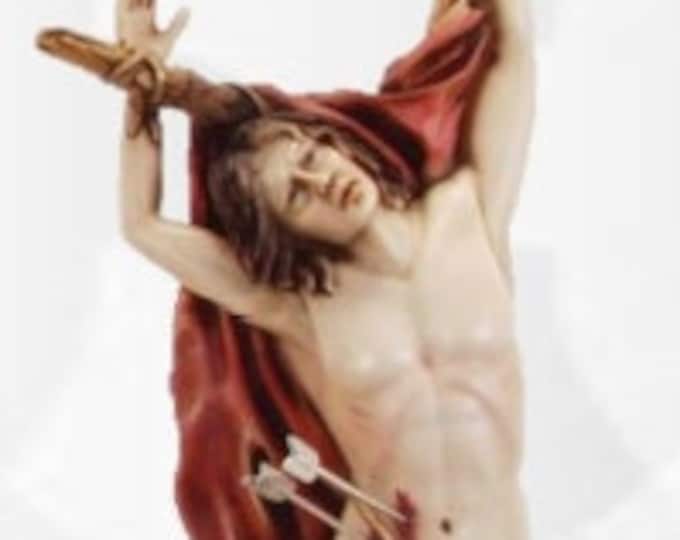 Statue of St. Sebastian cm 40 x 19 (15,74 x 7,48 inches) in hand-decorated resin of handcrafted production ideal for interiors and exteriors