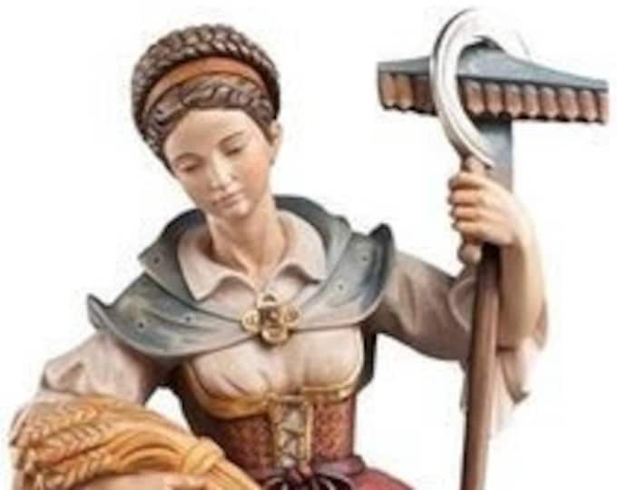 Statue of St. Notburga carved in wood from Valgardena and decorated by hand of Italian handicraft production