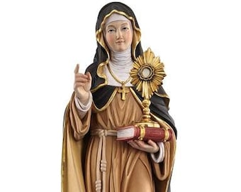 Statue of Saint Clare of Assisi carved from Valgardena wood and hand-decorated, handcrafted in Italy.