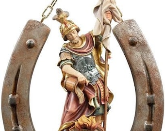 Sculpture of St. Florian on horseshoe, carved in wood of Valgardena decorated by hand of Italian artisan production
