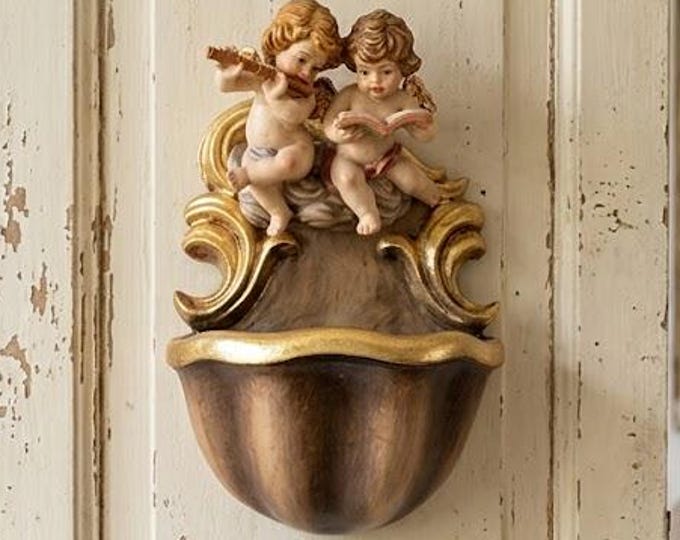 Holy water stoup with a pair of angels, carved in Valgardena wood and hand-decorated with gold leaf oil paints, made in Italy