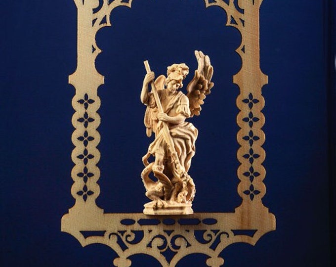 Statue of St. Michael the Archangel in the niche, carved in valgardena wood decorated by hand of Italian production