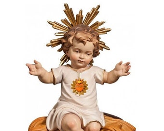 Sculpture statue of baby Jesus with Heart sitting, carved in Valgardena wood and decorated by hand, of Italian artisan production