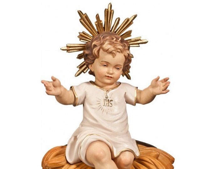 Sculpture statue of baby Jesus sitting on a cradle, carved in Valgardena wood and hand-decorated, of Italian artisan production