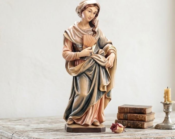 Statue of Saint Martha carved from Valgardena wood and hand-decorated, handcrafted in Italy.