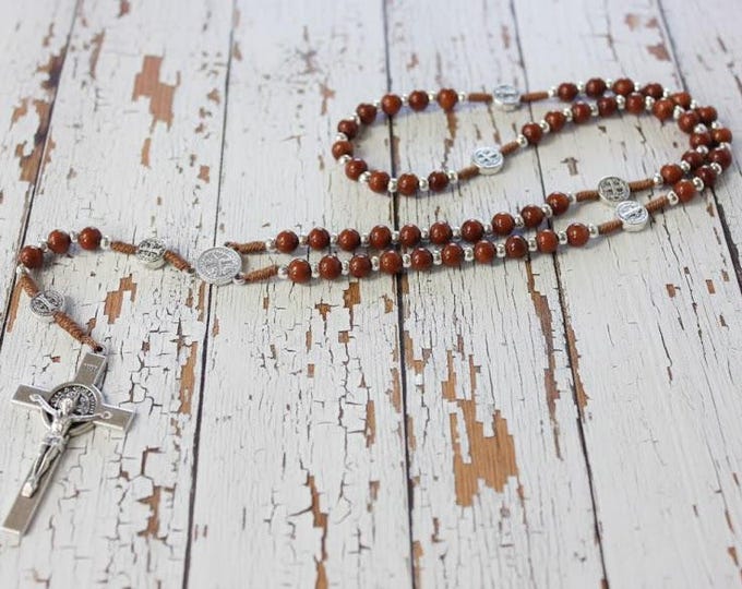 Rosary of Saint Benedict of Norcia in rosewood tied with a cord and a metal cross, handcrafted in Italy.